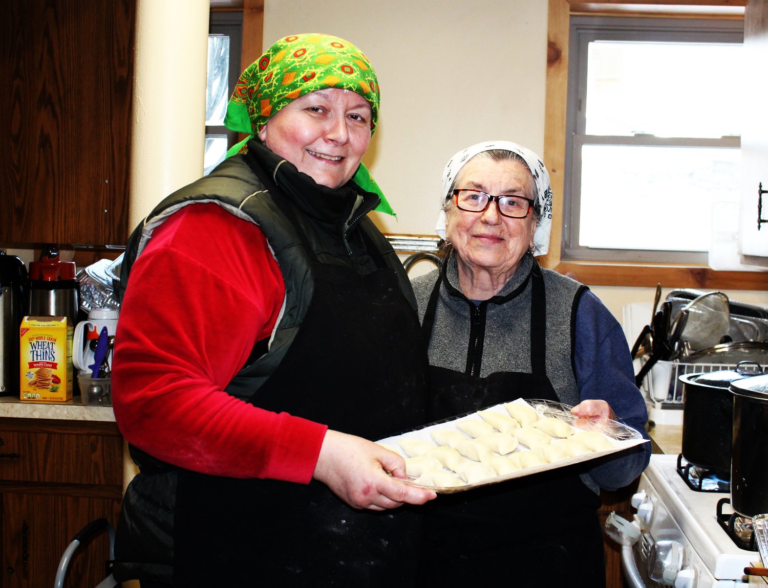 Maria Nakonczna and Irena Kostiuk prepare to plunge the delicacies into salted boiling water in the final stages of pierogi-making.